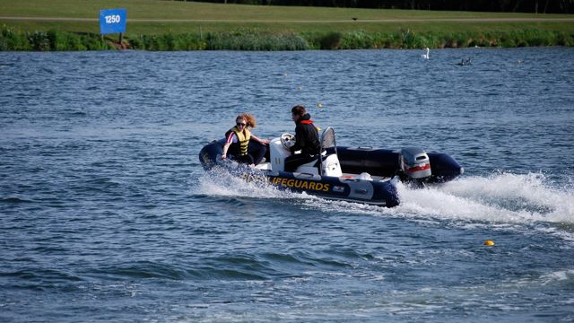 Rigid inflatable boat completing a high speed turn