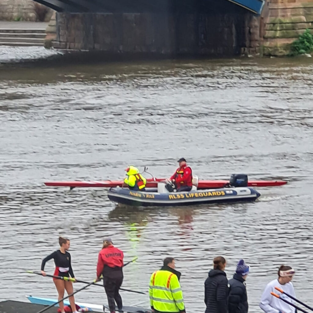 Lifeboat with rowingboat in tow