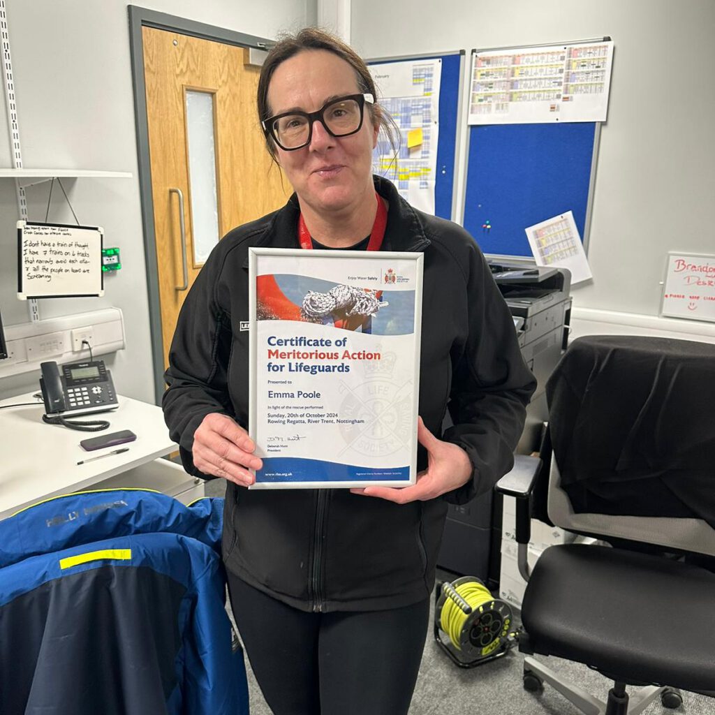 Emma Poole with her award from the RLSS