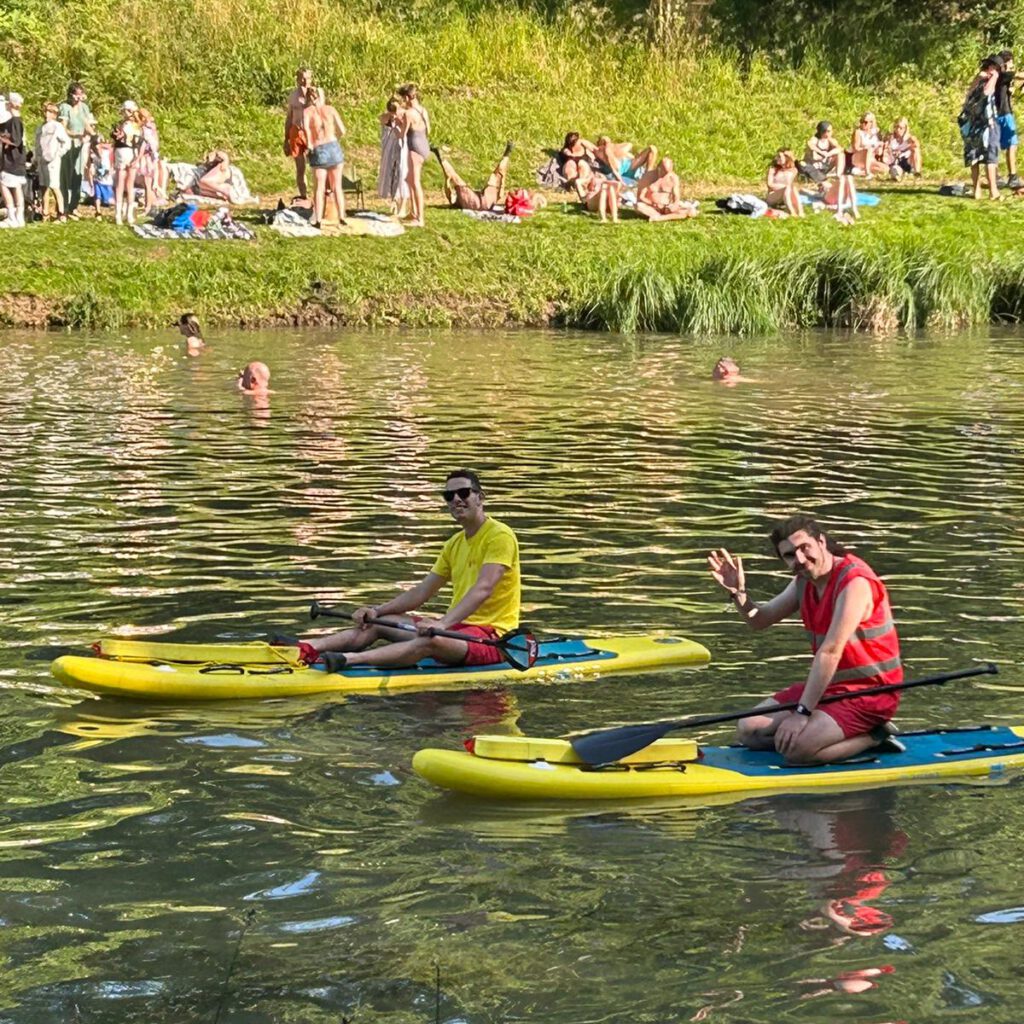 Lifeguards on paddleboards on lake