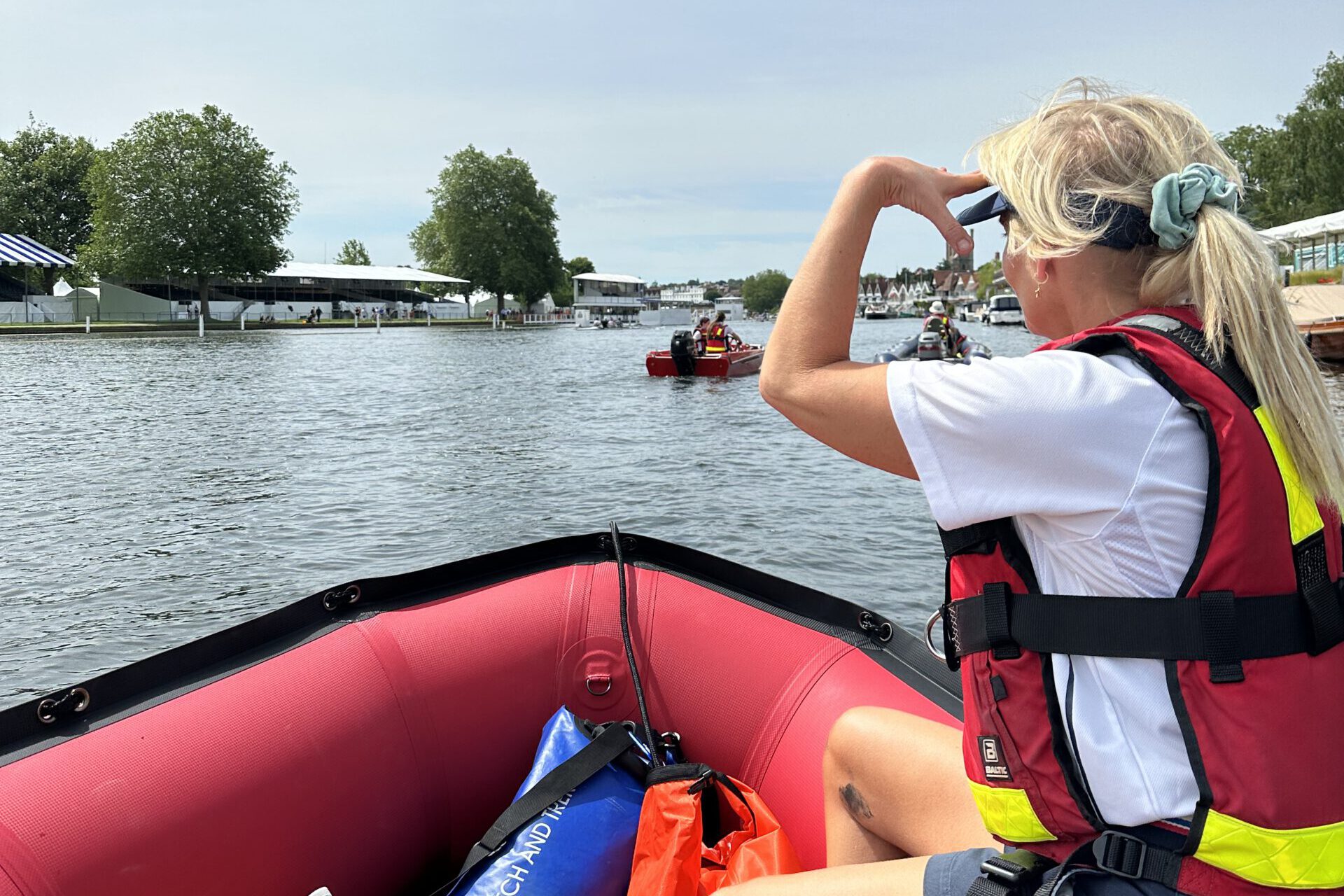 Lifeguard watching the river while on a boat
