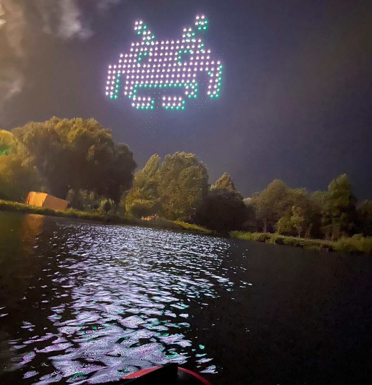 Drone lights at a festival over the lake