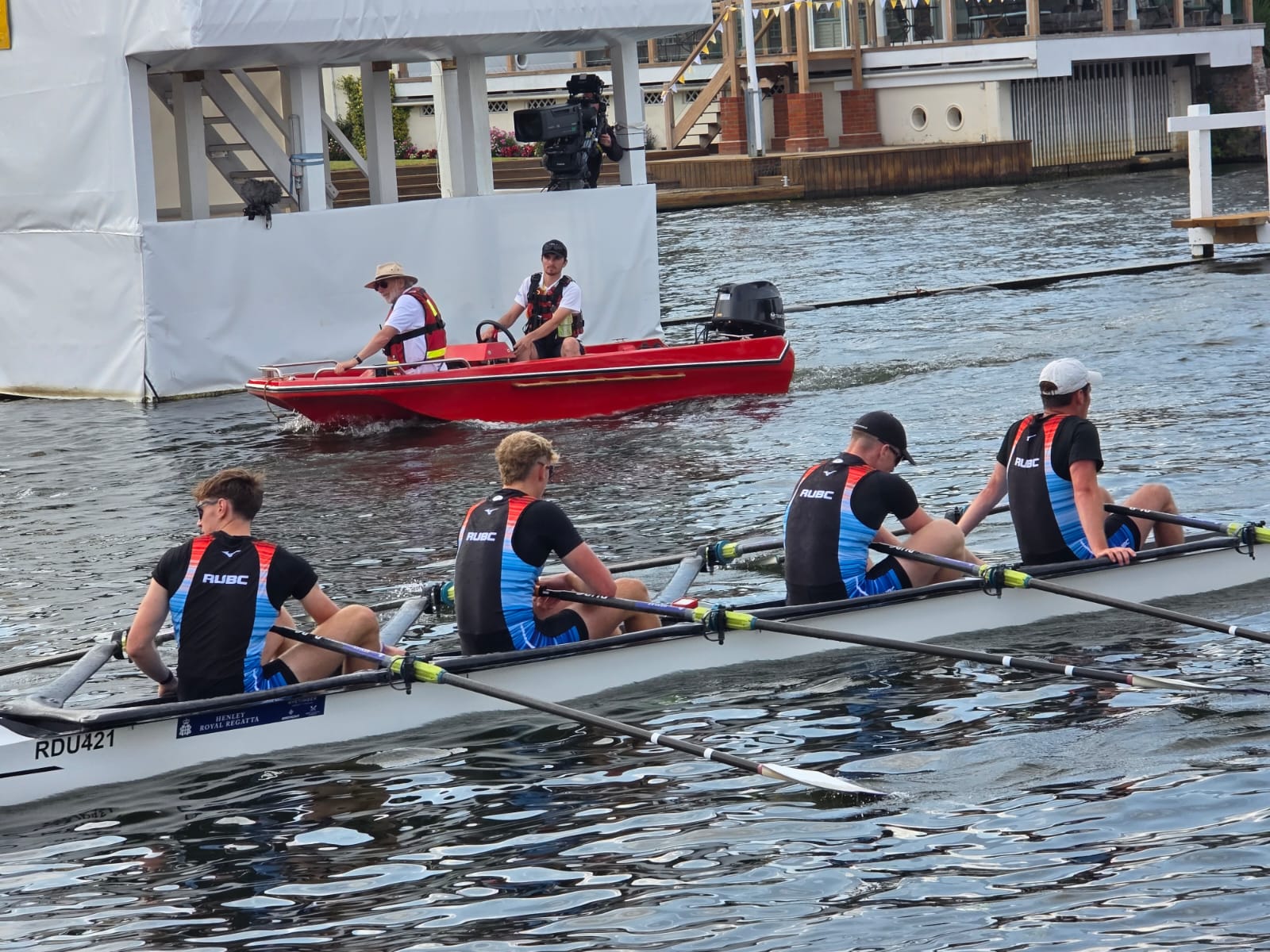 Safety boat watching rowers