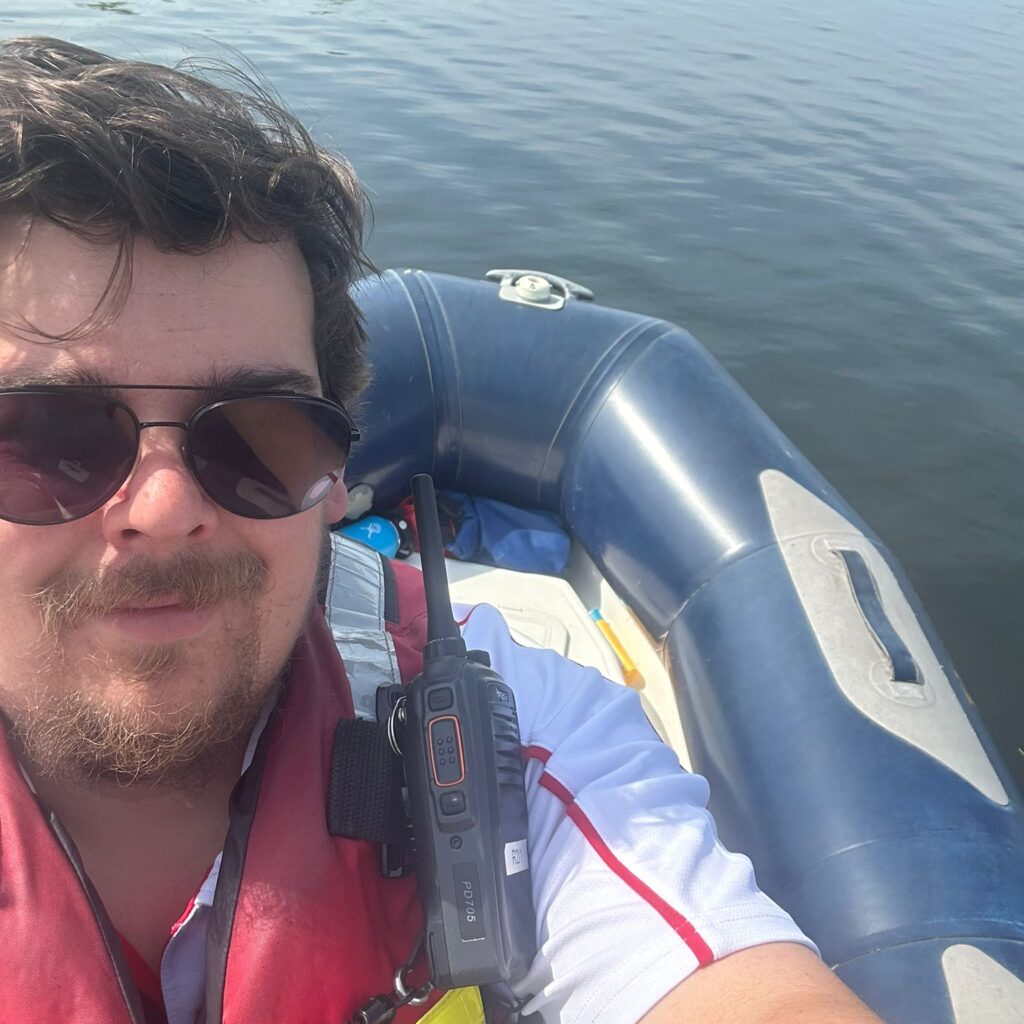 Safety boat team member on boat