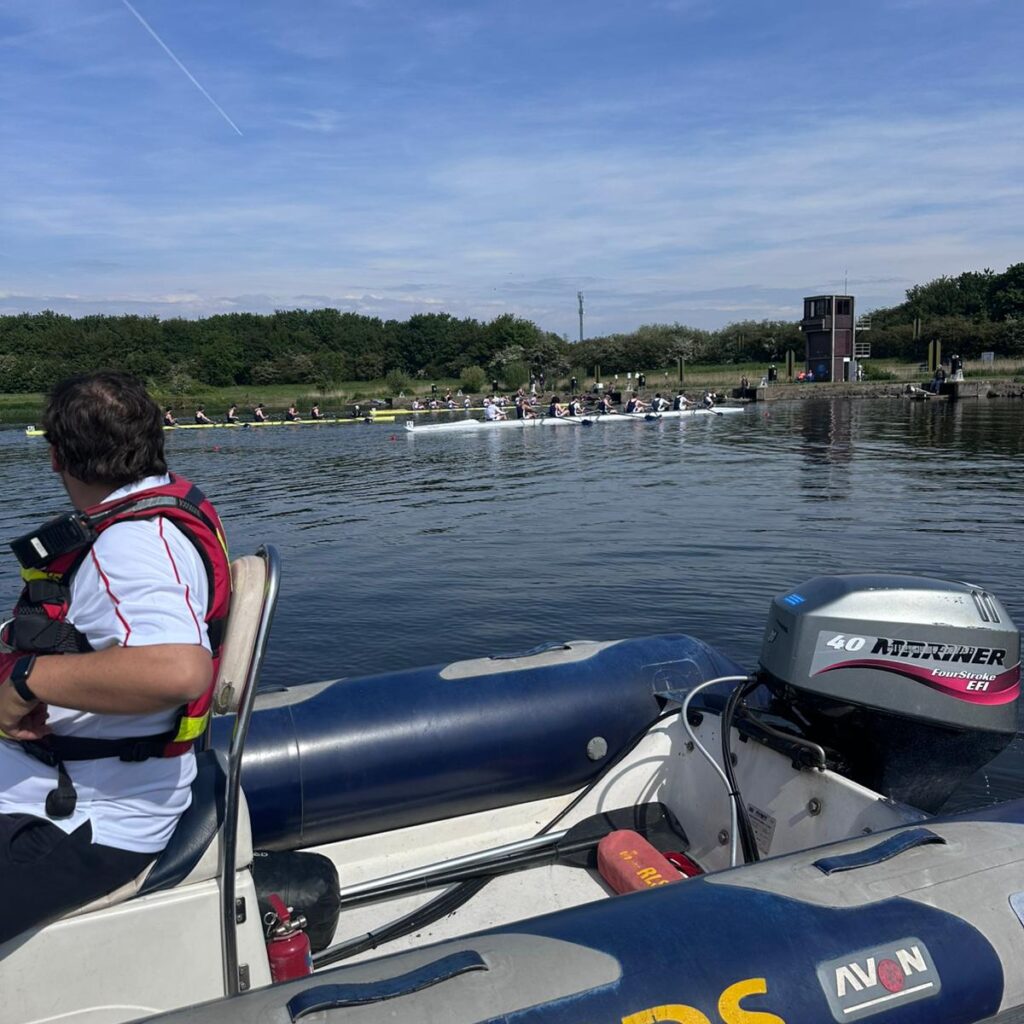 Safetyboat watching rowing race