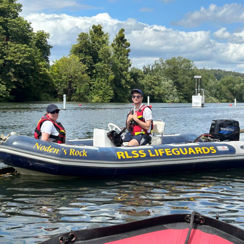 Safety boat and crew member at Henley Royal Regatta