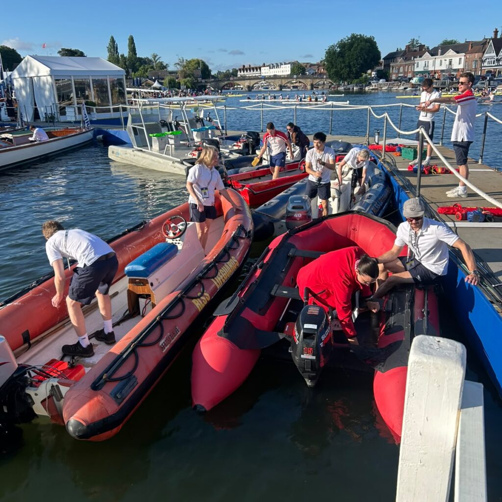 Lifeguard team cleaning safety boats