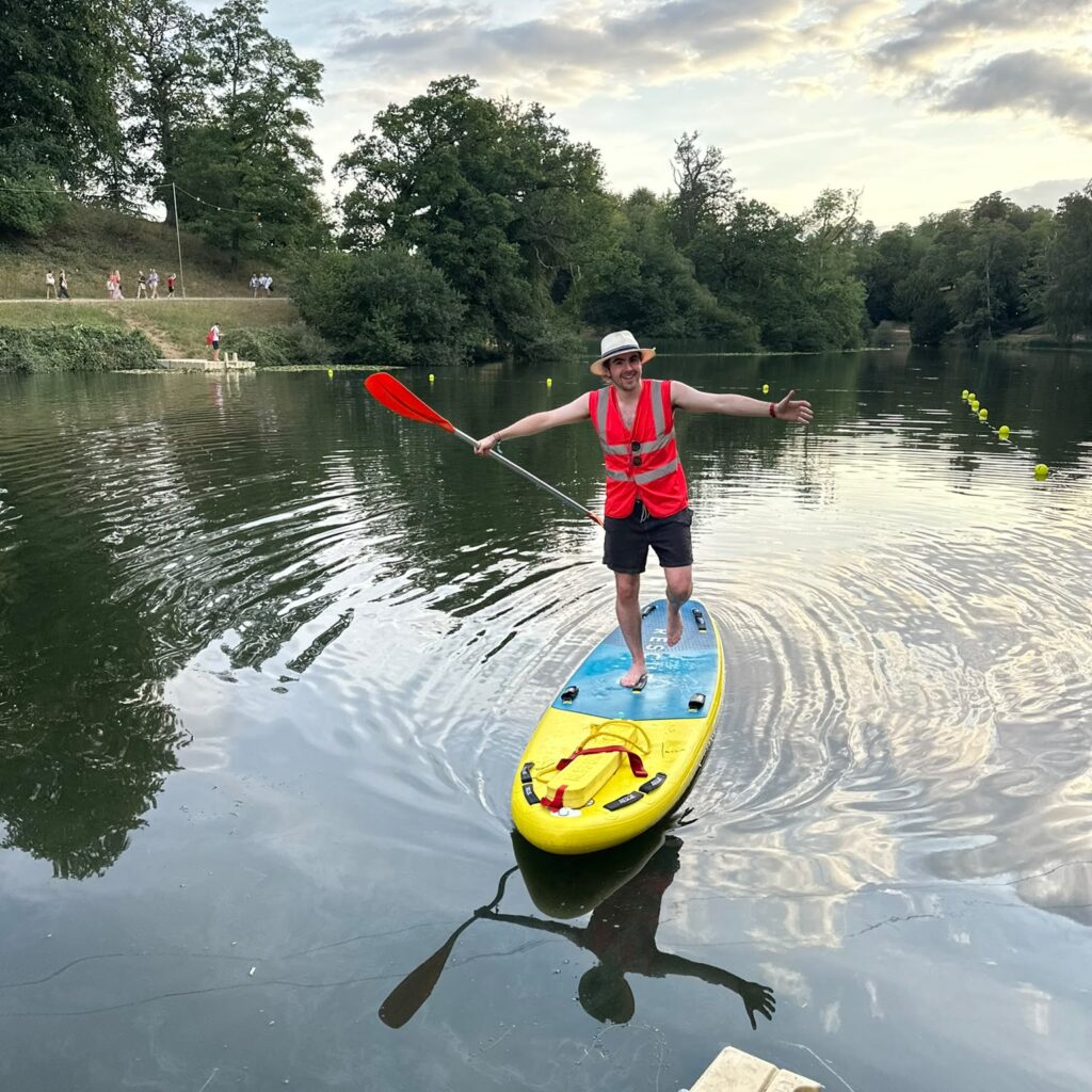 Lifeguard balancing standing up on a paddleboard