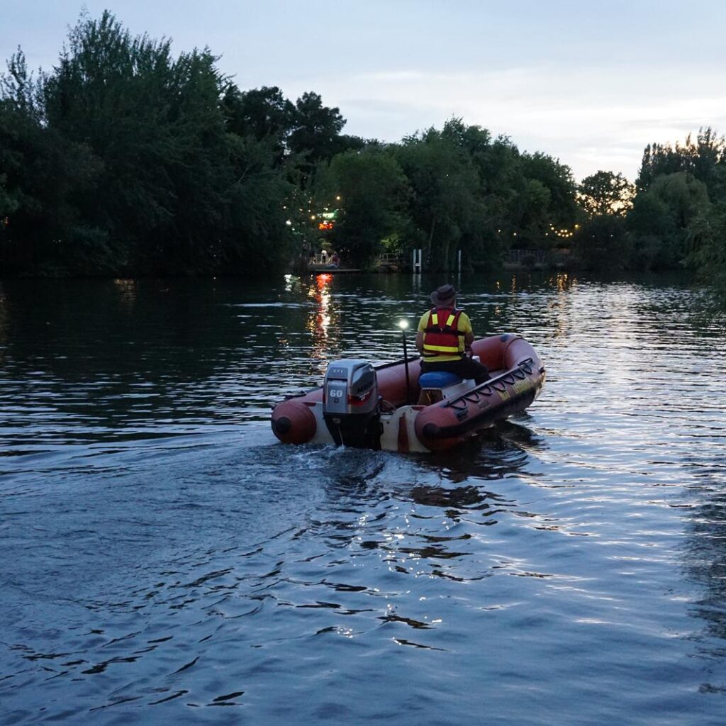 Safety boat departing at nighttime