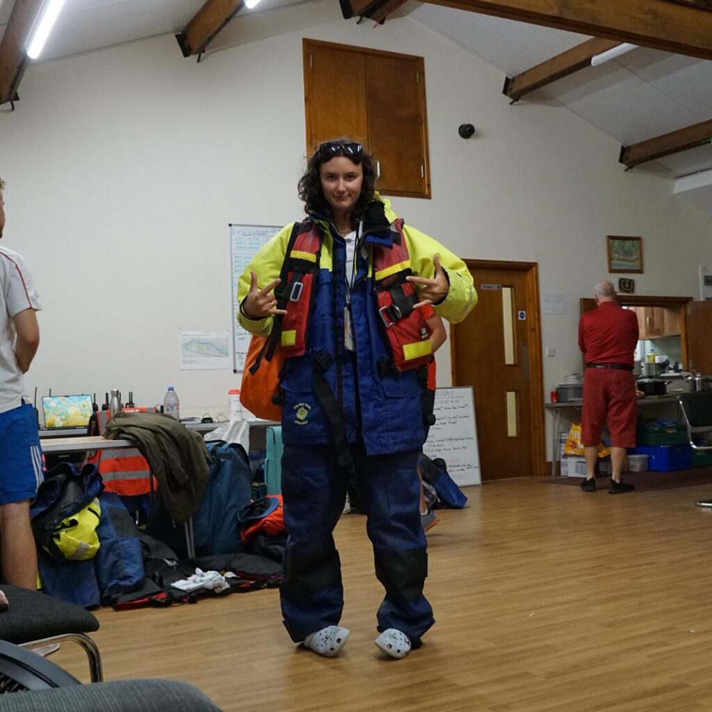 Lifeguard kitted out with waterproof gear and buoyancy aid