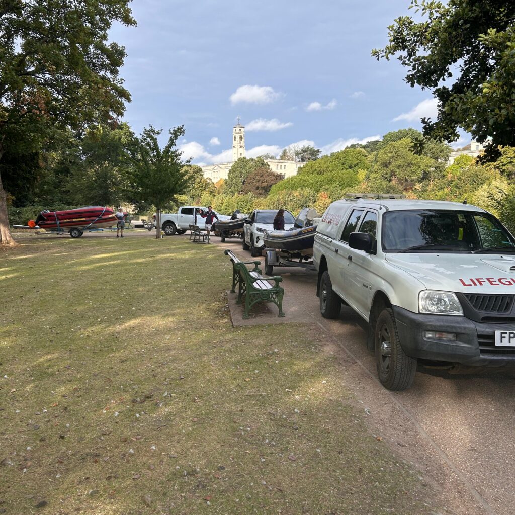 Safety boats on trailers attached to lifeguard vehicles